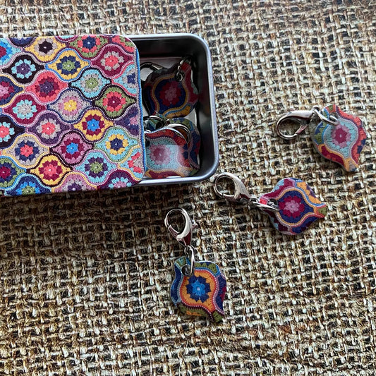 Mystical Lanterns Stitch Markers In A Pocket Tin by Emma Ball